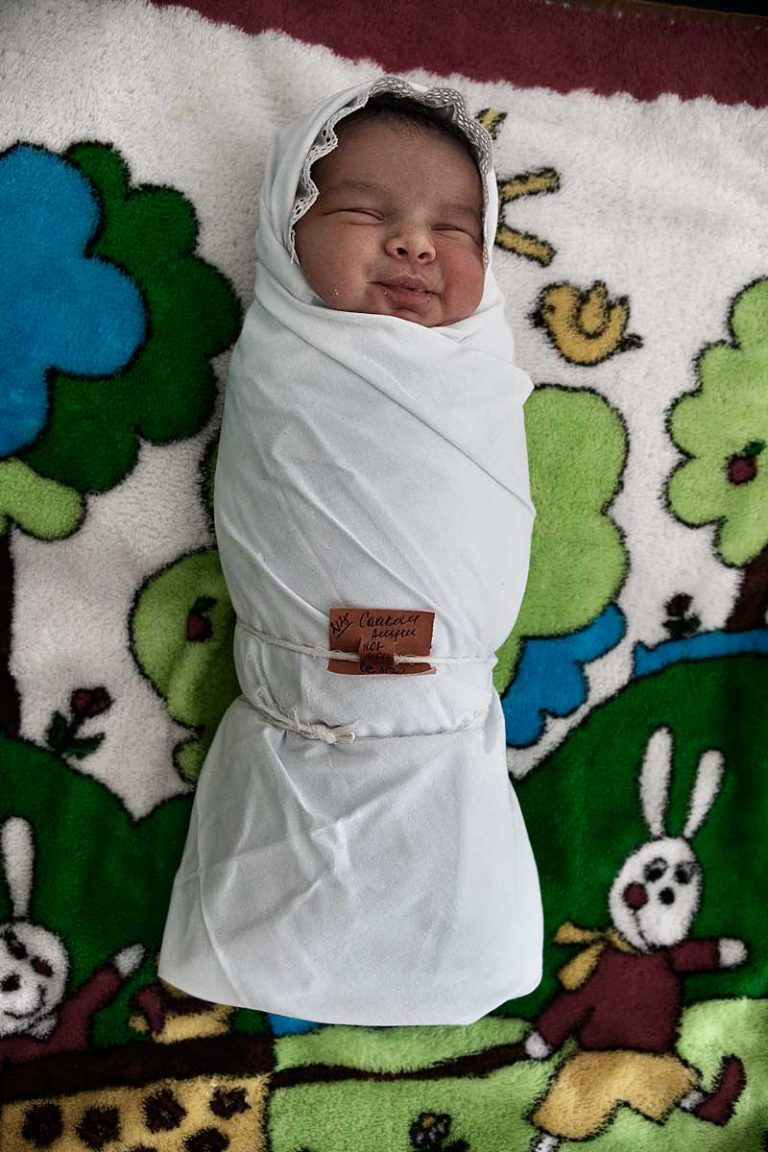 It is a tradition to wrap up a new born baby tightly to make his or her legs straight. Even though doctors tell mothers that this system may be not healthy for the baby, they continue to follow the tradition.