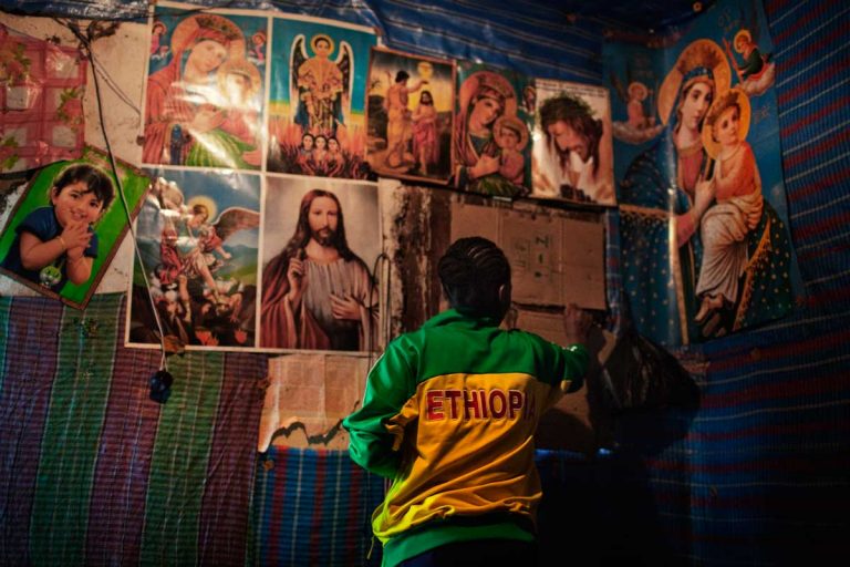 Bekoji, Ethiopia. August 2013. Runners and saints are the images usually found in the rooms of young runners.