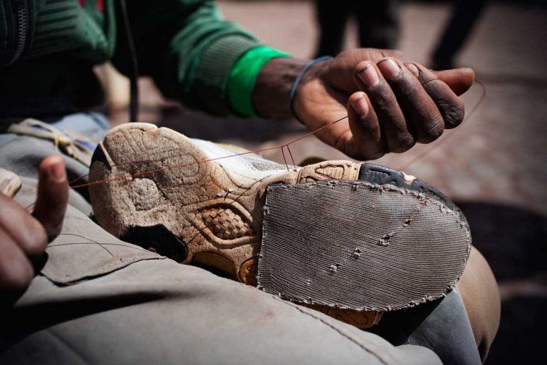Bekoji, Ethiopia. August 2013. Running shoes are of vital importance in Bekoji. Once they get worn out they must be repaired because runners don't have enough money to get new ones. To buy new running shoes is a long term investment.